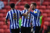 Jordan Rhodes of Sheffield Wednesday celebrates with Josh Windass and Joey Pelupessy.