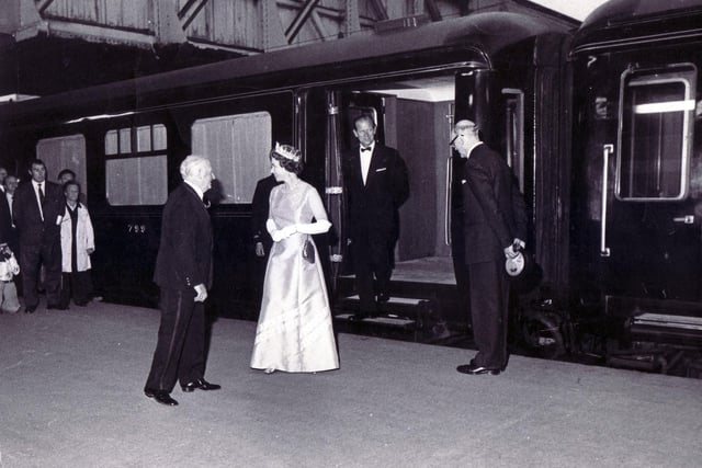 The Royal train draws into Midland Station - July 29, 1975. The Queen with Prince Philip behind her, are greeted by the Lord Mayor of Sheffield (Coun Albert Richardson) with the Station Manager, Mr. Ralph Tunnicliffe on the right