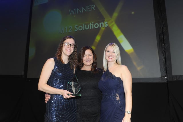 Mandy Magee, regional commercial manager for JPIMedia, centre, with winners of the Training Programme of the Year Award M12 Solutions.
(210220-8509)