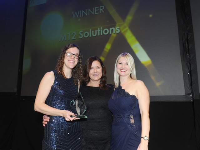 Mandy Magee, regional commercial manager for JPIMedia, centre, with winners of the Training Programme of the Year Award M12 Solutions.
(210220-8509)