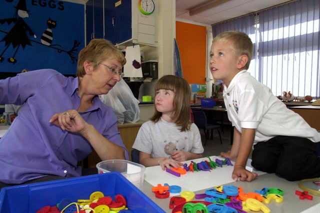 Abbey Lane Primary school, Woodseats, Sheffield, where the school's new starters were settling in in 2003. Seen is teacher  Julia Quin with  pupils Emma Vardy, and Noah Platton