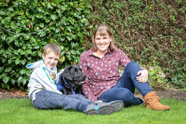 Sam Mills with mum Emma, and support dog Willow Star
