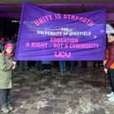 A banner showing support at a student-staff rally on the Sheffield Student's Union concourse