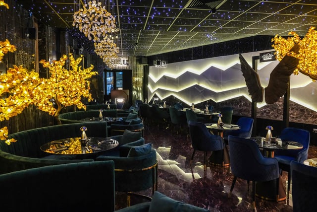 The restaurant features a dazzling interior design with stars lighting up the ceiling