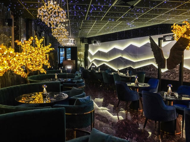 The restaurant features a dazzling interior design with stars lighting up the ceiling
