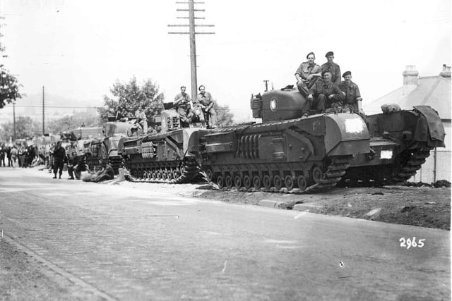 Churchill Tanks parked on the roadside
