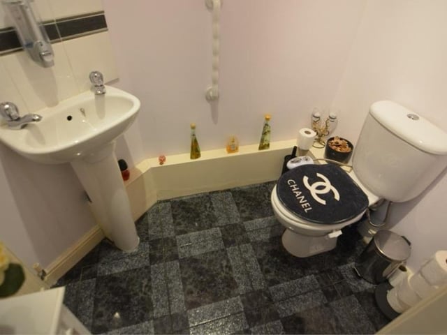 This compact toilet completes the ground-floor amenities. It comprises a low-flush WC and a wash hand basin.
