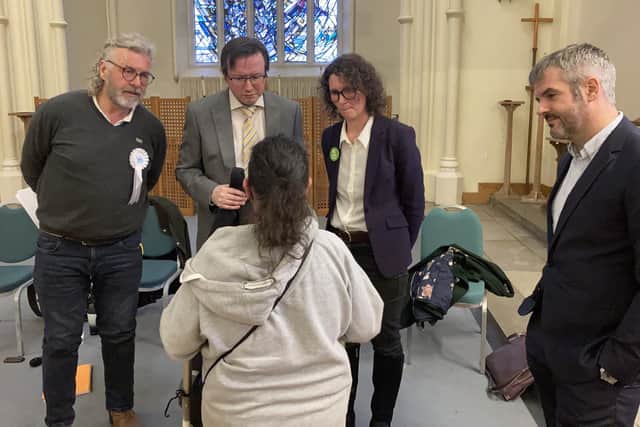The candidates speak to a voter following the event at St Mary's Church on Bramall Lane in Sheffield. Credit: George Torr/LDRS