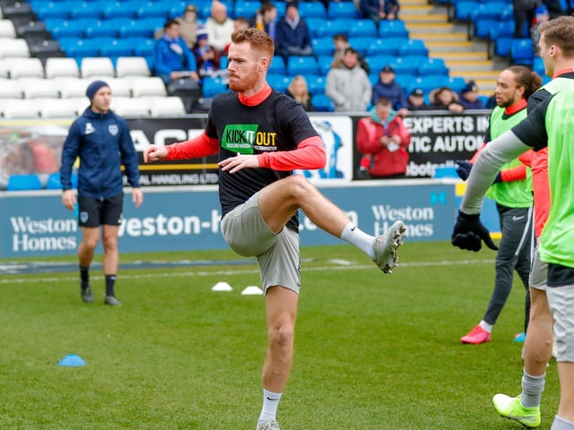 Tom Naylor warming up ahead of kick-off