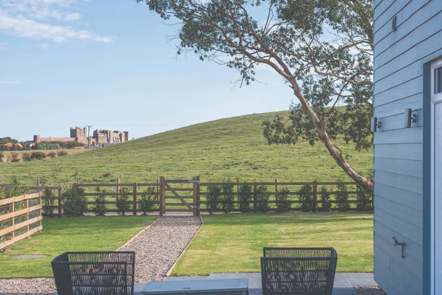 The property is surrounded by open aspect views across adjoining countryside and to the front towards the village, adjacent coastline, and Bamburgh Castle.