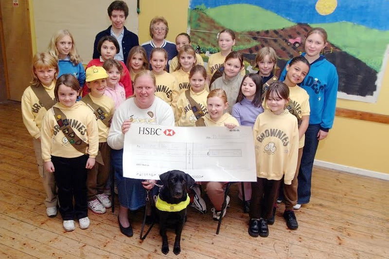 Blidworth Guides and Brownies presenting a cheque to Guide Dogs for the Blind