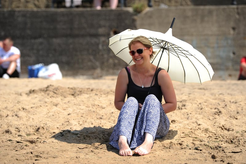 Karen Dear, enjoying the hot weather while catching some shade at Hartlepool Headland's Fishsands.
