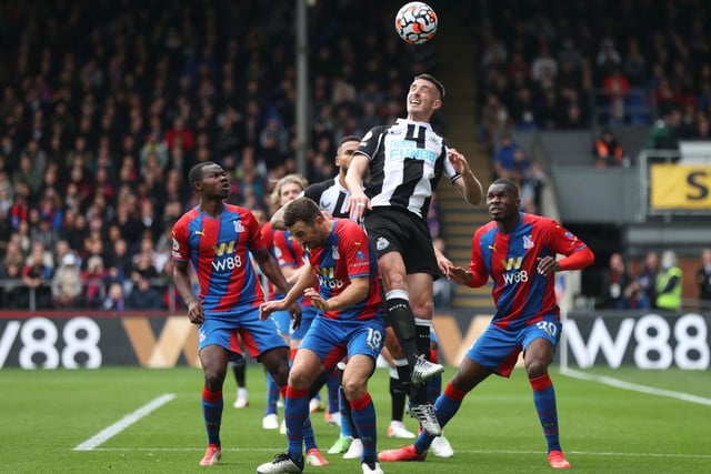Ciaran Clark of Newcastle United heads above James McArthur of Crystal Palace during the Premier League match between Crystal Palace and Newcastle United at Selhurst Park on October 23, 2021 in London, England.