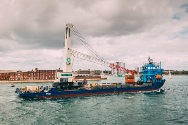The 432-tonne mobile harbour crane arrives in Portsmouth Harbour.