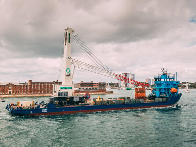 The 432-tonne mobile harbour crane arrives in Portsmouth Harbour.