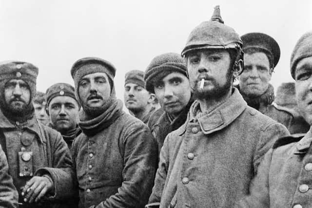 Members of the London Rifle Brigade fraternise with German soldiers on Christmas Day 1914. Photo: IWM North, part of Imperial War Museums