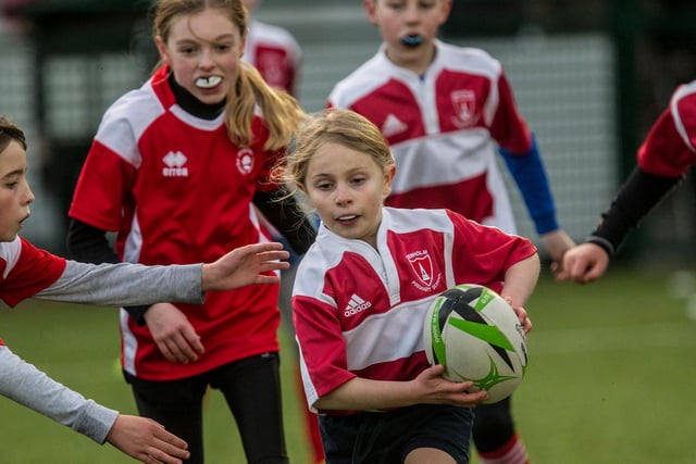 Annabel Thomson on the charge with the ball for Denholm Primary at Volunteer Park in Hawick