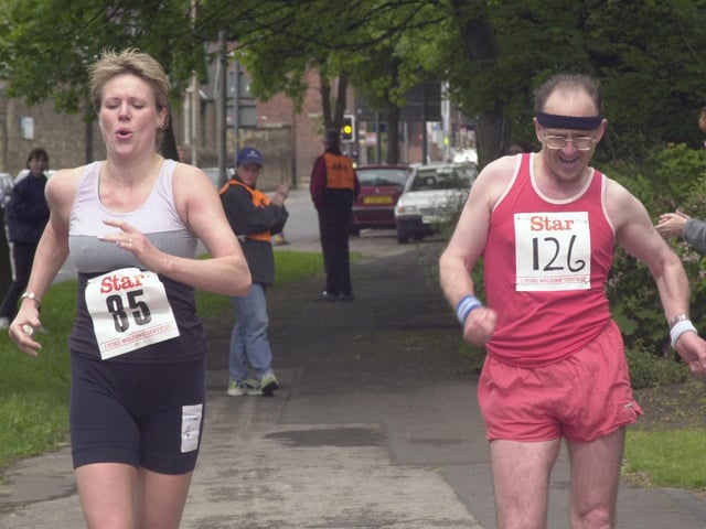 Two walkers battle it out right to the finish line at Hillsborough Park in 2000