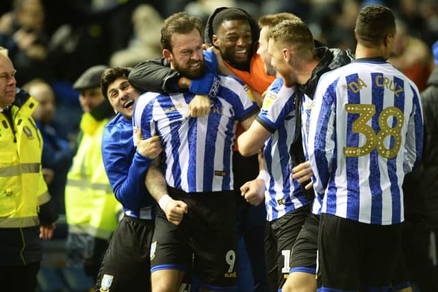 Super-sub Steven Fletcher is mobbed by his team-mates after scoring a 94th minute winner for Sheffield Wednesday against Charlton Athletic.