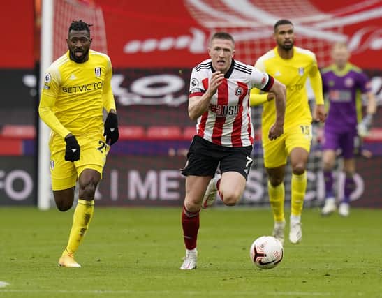 John Lundstram of Sheffield Utd  makes a break during the Premier League match at Bramall Lane, Sheffield. Picture date: 18th October 2020. Picture credit should read: Andrew Yates/Sportimage