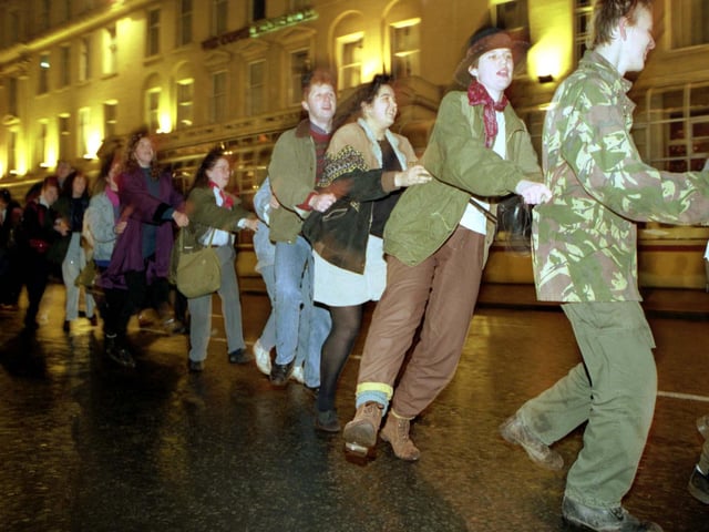Glaswegians celebrate the end of Glasgow Year of Culture with a street party and conga line in George Square on Hogmanay 1990.