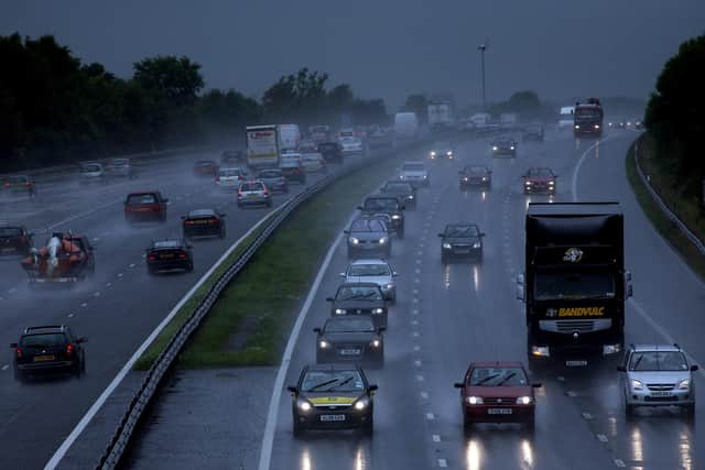 Traffic drives through heavy rain on the M5 Motorway  (Photo by Matt Cardy/Getty Images)