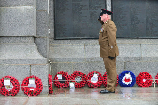 A sergeant major from the Cleveland County Army Cadet Force's salutes after laying a wreath.