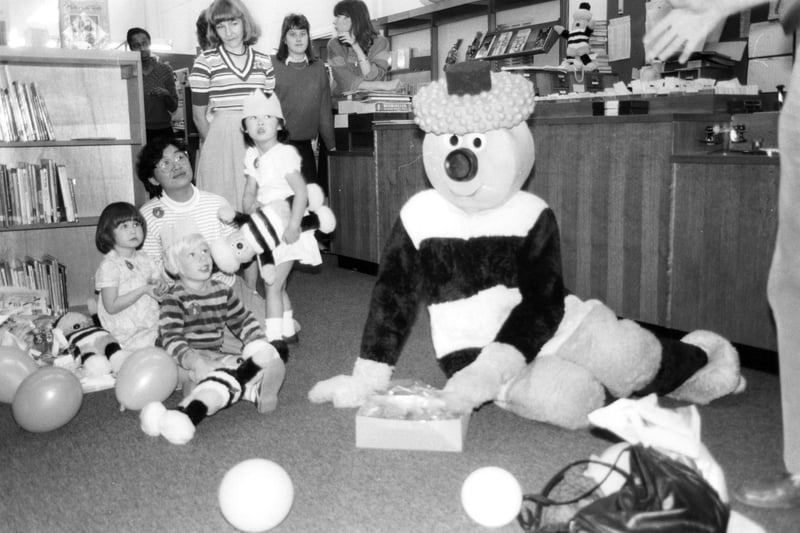 Bertie Bassett visits the Central Children's Library, Central Library, Surrey Street, 1986. The picture shows librarian, Sheila Hawker (2nd left) Ref no s46651