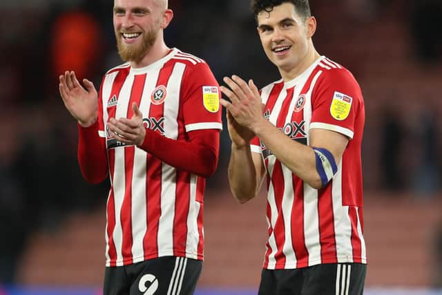 Oli McBurnie and John Egan of Sheffield United applaud the fans after their 2-0 win over West Bromwich Albion: Simon Bellis / Sportimage