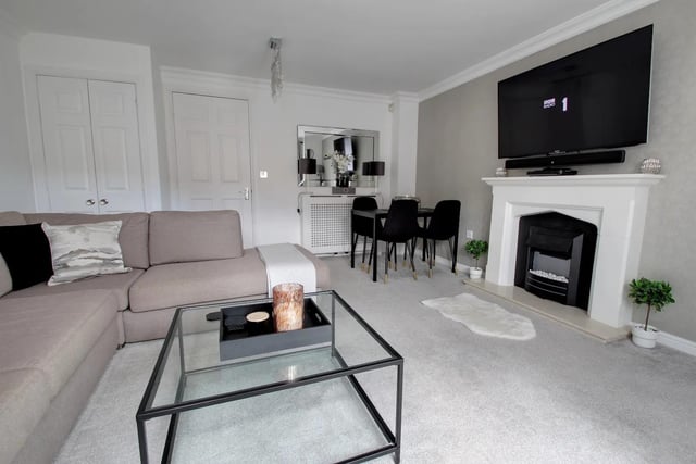 The lounge is bright and spacious with French doors opening onto the garden, electric feature fire and surround, useful built in storage cupboard and ample space for dining table and chairs.