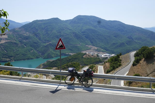 Mike said: "Steep ride in Albania, fortunately on paved road. The artificial lake of a dam below, the reality of which disturbs local ecosystems and ways of life."