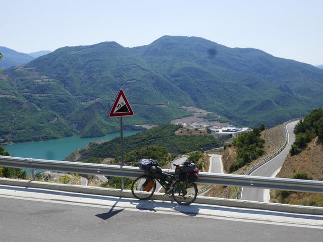 Mike said: "Steep ride in Albania, fortunately on paved road. The artificial lake of a dam below, the reality of which disturbs local ecosystems and ways of life."
