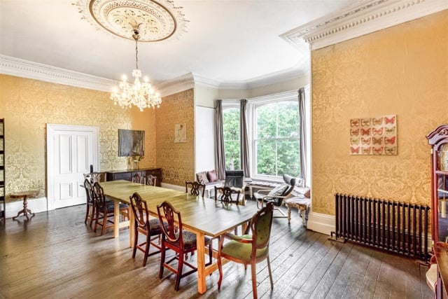 Imagine sitting down to dinner here. You would certainly feel like the lord or lady of the manor! The impressive dining room boasts a large bay window with a window seat, offering views of the countryside. It also has cast-iron radiators, oak flooring and a feature open fireplace.