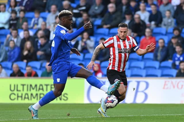 Cardiff City's Cedric Kipre (left) and Sheffield United's Billy Sharp during the Sky Bet Championship match at Cardiff City Stadium: Simon Galloway/PA Wire.