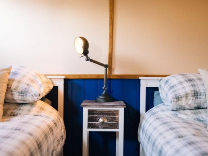 One room has two twin beds.