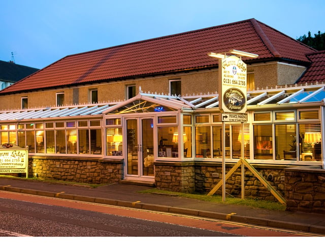The first floor features a light-filled conservatory which is used for a breakfast area for guests.