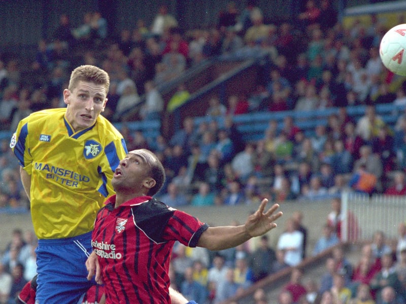 Much maligned striker Mark Sale wins this header against Scarborough.