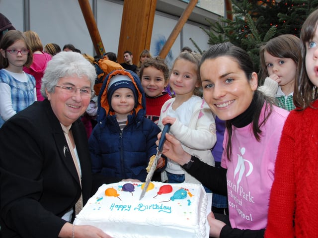 Leader of the Council, Cllr Jan Wilson, holding the 5th anniversary Winter Gardens birthday cake with Catherine Newman of the Weston Park Hospital Appeal. Sharing in the celebrations are the Children of the Bethany School reception - all aged 5 back in 2007