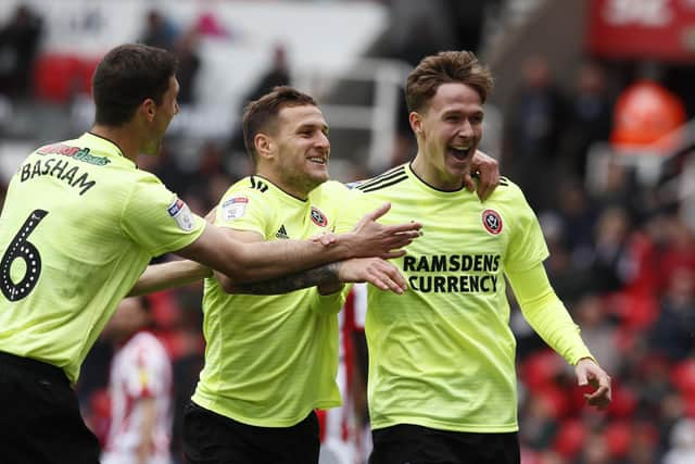 Kieran Dowell, now of Norwich City, celebrates scoring on his final appearance for Sheffield United at Stoke City: Simon Bellis/Sportimage
