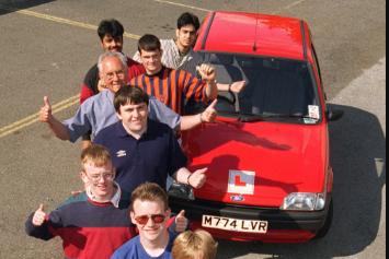 Deaf School students celebrating passing their drivers tests in 1996.