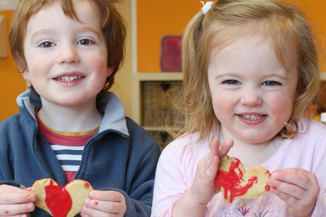 Two-year-olds Harry Johnson and Hallie Slater have fun making heart-shaped biscuits for Valentine's Day 2008 at Treetops Nursery in Matlock.