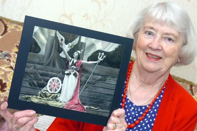 Joan Watson from Balby photographed with a photo of herself from her youth as a performer, 2005.