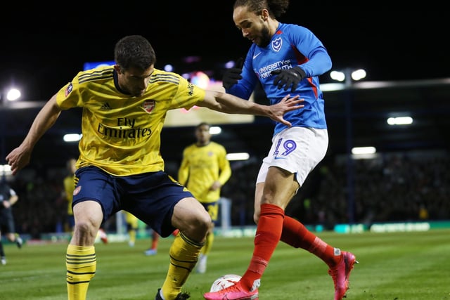 Portsmouth's Marcus Harness battles with Arsenal's Sokratis Papastathopoulos in the first half.