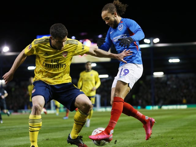 Portsmouth's Marcus Harness battles with Arsenal's Sokratis Papastathopoulos in the first half.