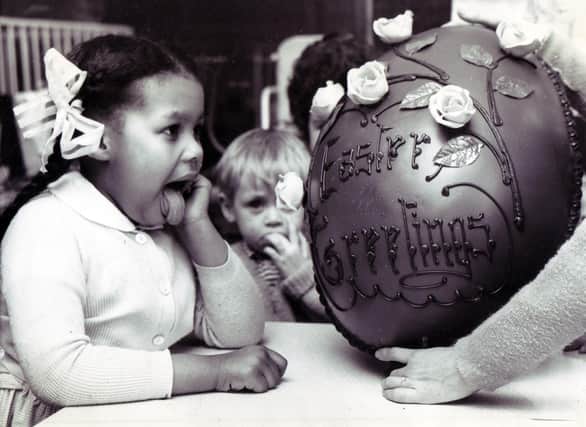 Licking her lips in anticipation of the forthcoming feast is 4-years-old Patricia Wells, one of the patients of the Sheffield Children's Hospital, who helped to dispose of this giant Easter egg presented to the hospital by Sheffield department store, Walsh's... March 1967