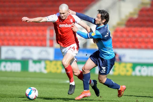 Rotherham's Michael Smith gets away from a grappling Joe Jacobson