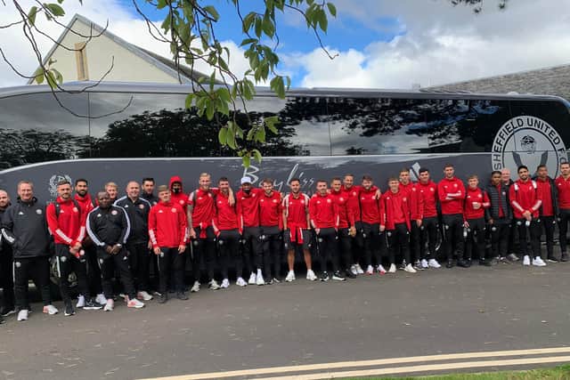 Sheffield United's squad in front of their plush first team coach during pre-season training in Scotland: Kevin Cookson