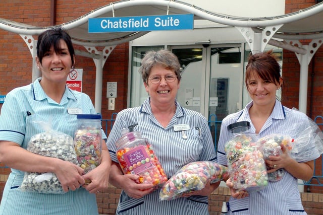 Staff from DRI's Chemotherapy Unit with some of the sweets given by individuals and companies (from left) Karen Marr, Healthcare Assistant; Joyce Burman, Sister; and Julie Parkes, Staff Nurse in 2005