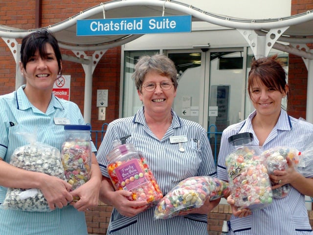 Staff from DRI's Chemotherapy Unit with some of the sweets given by individuals and companies (from left) Karen Marr, Healthcare Assistant; Joyce Burman, Sister; and Julie Parkes, Staff Nurse in 2005