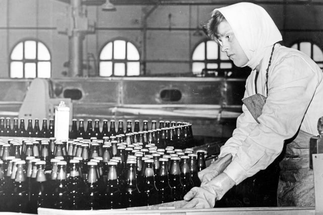 Working on the bottling machines at the Exchange Brewery in July 1962
